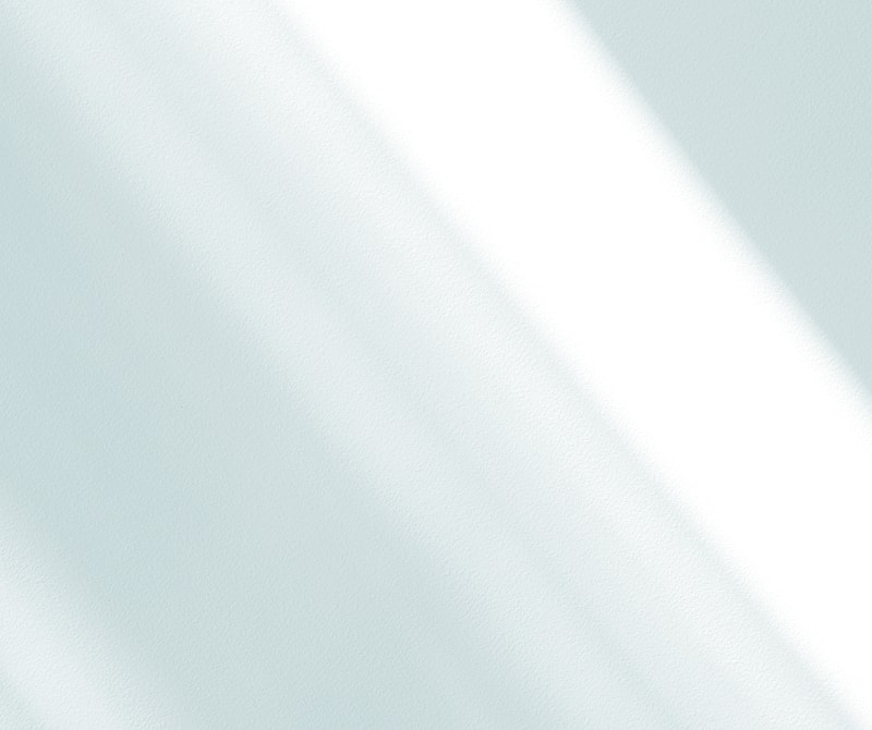 Soft light shadows on a textured surface.