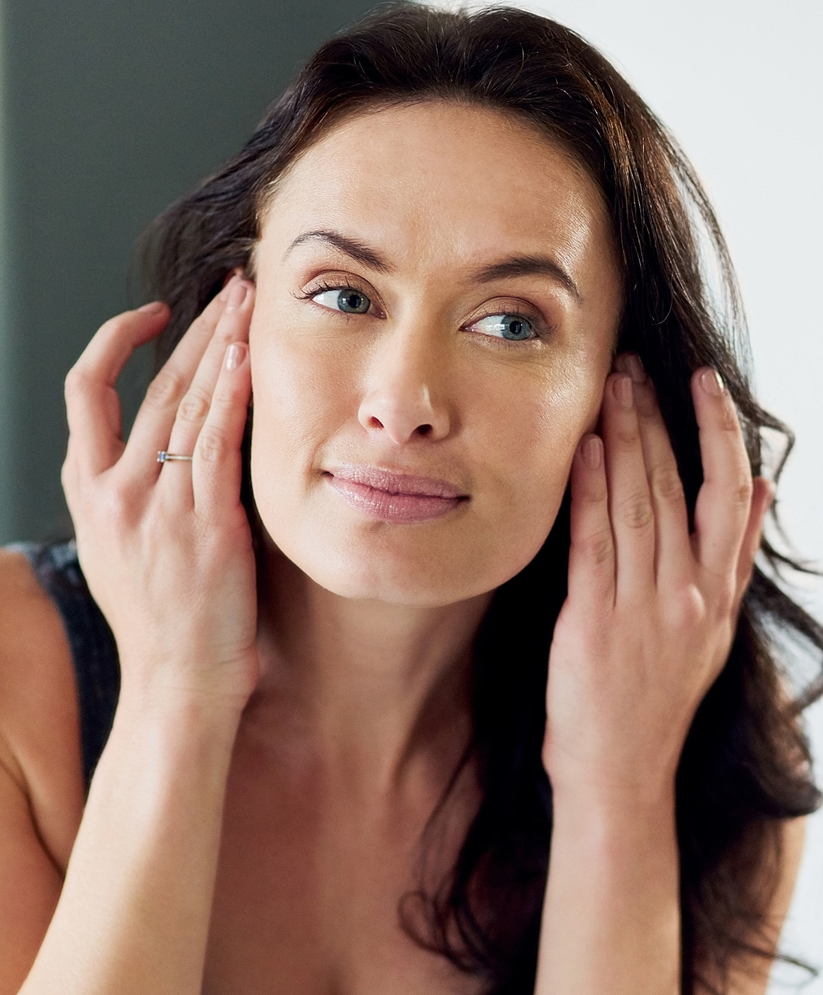 Woman caring for her skin, natural beauty routine.